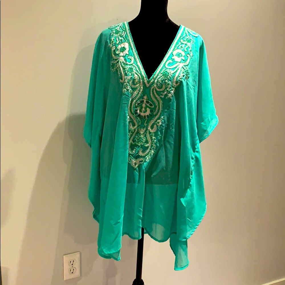 Beaded sheer blouse.